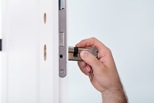 locksmith fitting a new lock